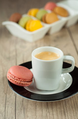 Colorful macaroons over turquoise wood backround