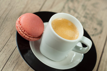 Colorful macaroons over turquoise wood backround