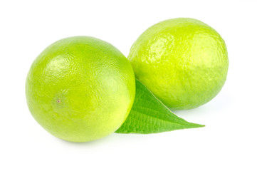 Two lime with leaf on white