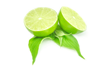 Two half of fresh lime with leaves isolated on white background
