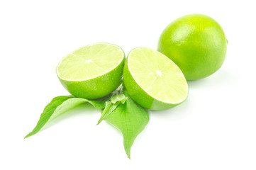 Fresh lime with two half and leaves isolated on white background