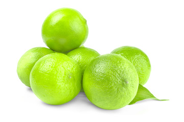 Group of ripe limes on white background