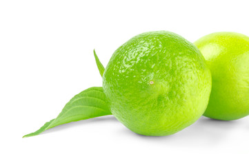 Lime with leaves on a white background
