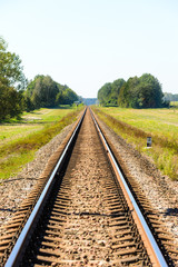 Fototapeta na wymiar Railroad tracks stretching into the distance.
