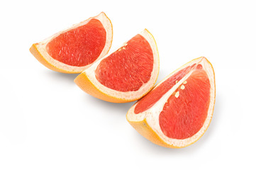 Fototapeta na wymiar Fresh grapefruit wedge isolated on a white background