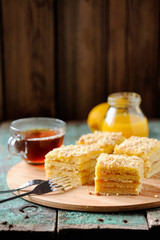 Homemade yummy layered lemon cake served with tea and lemon curd
