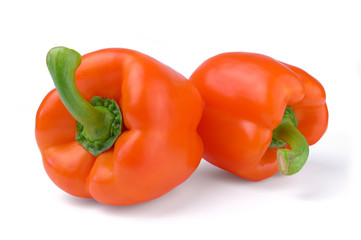 Two red sweet peppers isolated on white background