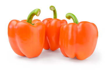 Three red sweet bulgarian peppers isolated on white background