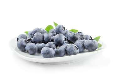 Fresh blueberries in a white plate
