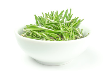 Fresh rosemary in a bowl on white background