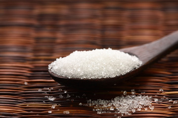 Fototapeta na wymiar sugar in wooden spoon