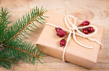 Fototapeta na wymiar Rustic gift box with kraft paper. Christmas gift.