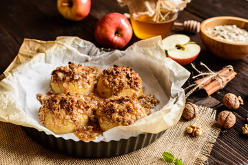 Baked apple with oatmeal, walnuts, honey and cinnamon