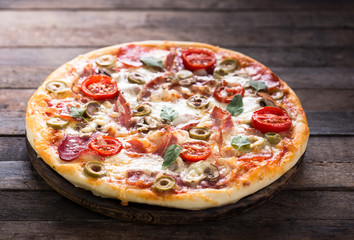 Homemade pizza on the wooden table 