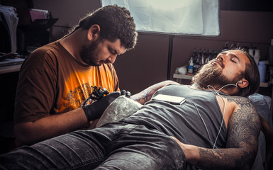 Tattoo specialist posing in studio