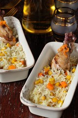 Garnish of boiled rice, corn, carrots and fried chicken legs