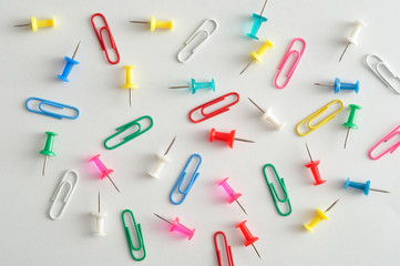 A collection of paper clips and push pins