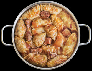 Cabbage Rolls Stuffed With Minced Meat In Tomato Sauce Cooked In Stainless Steel Saucepot Isolated On Black Background