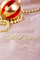 Festive gold Christmas decorations on fabric background