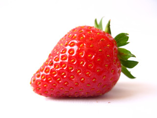 A single red strawberry isolated in white