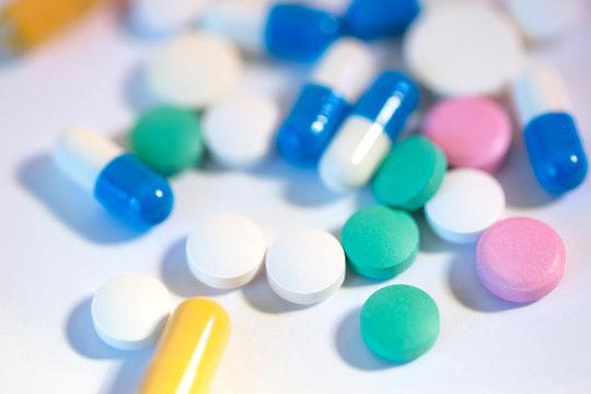 Colored pills on a white background.