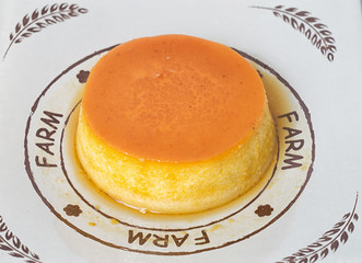 Closeup shot of egg baked caramel flan served on a dish