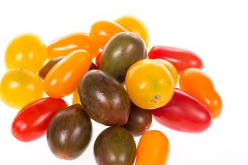 colored tomatoes on a pure white background
