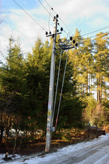 The transformer at the pole of the two poles of the fence