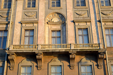 Fototapeta na wymiar The balcony of the building with an openwork grille