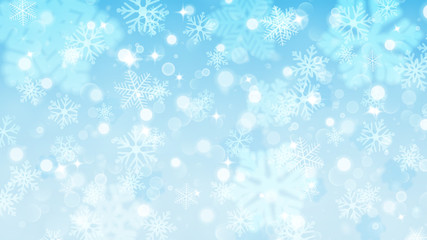 Christmas background of fuzzy and focused snowflakes