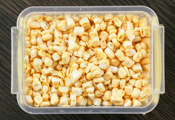 Tray with raw corn for freezing.