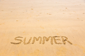 Fototapeta na wymiar Summer word written on sand