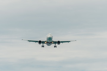 Aircraft landing in cloudy day
