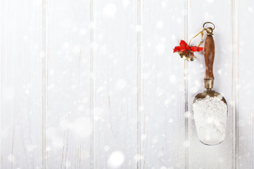 Christmas Background, Holiday.Flour vintage metal scoop with wooden handle on white background.Copy space. selective focus.Toned image.