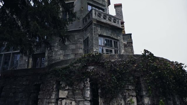 Old abandoned mansion in mystic spooky forest