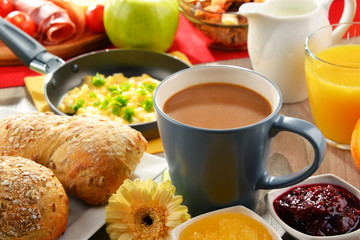 Breakfast served with coffee, juice, egg, and rolls