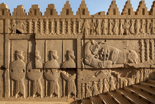 Achaemenid Bas Relief Carvings of Lion and Bull Combat Beside Soldiers in Persepolis
