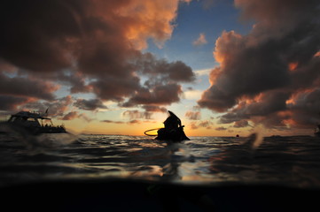 Obraz na płótnie Canvas Caribbean Sunset with Diver Sillouette