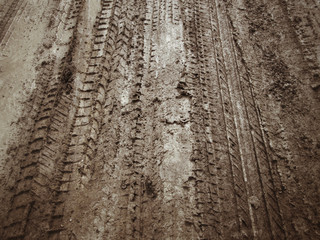 Wheel tracks on the soil.