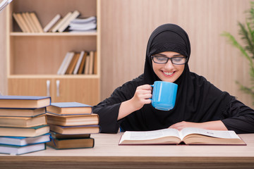 Woman muslim student preparing for exams