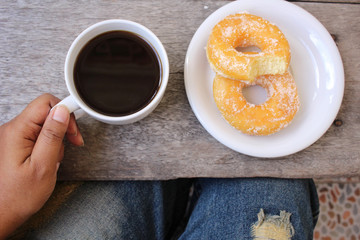 Selfie of donut with coffee cup