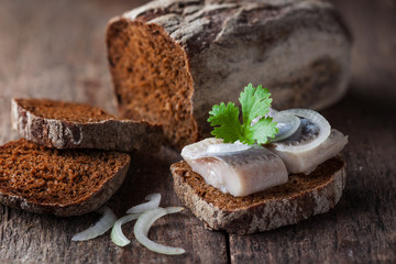 Salty fish slices on a bread
