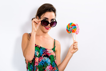 Young woman eating a lollipop