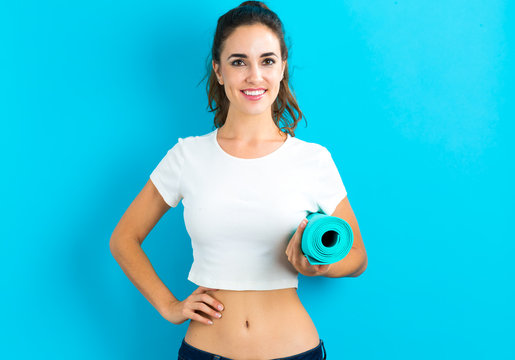 Woman Holding Yoga Mat