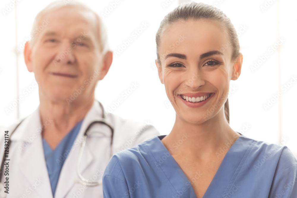 Wall mural Beautiful doctor and patient