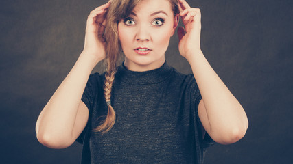 Blonde confused scared woman.