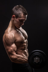 Fototapeta na wymiar side view, arm biceps triceps young bodybuilder dumbbell exercis