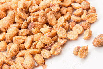 Honey roasted peanuts on a white background. - 125325575