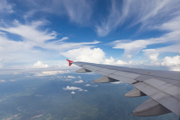 Fototapeta na wymiar Airplane wing with beautiful sky