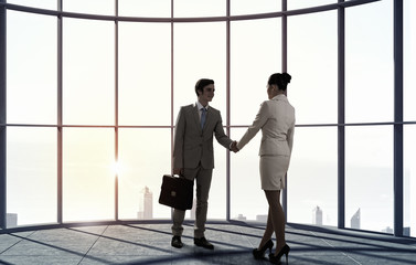 Fototapeta na wymiar Business partners handshake . Mixed media